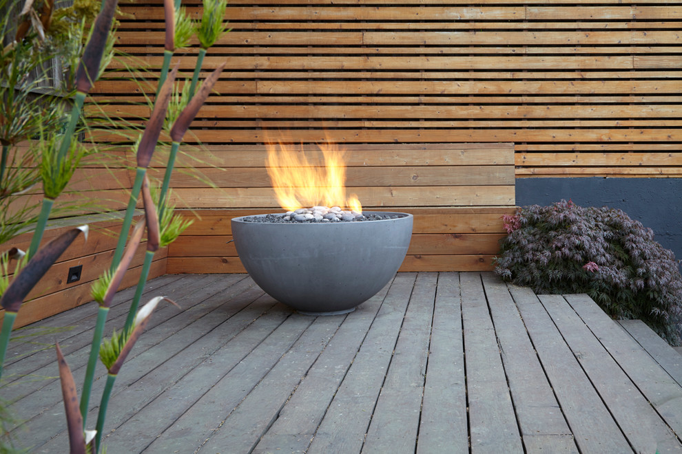 Design ideas for a mid-sized contemporary backyard deck in San Francisco with a fire feature and no cover.