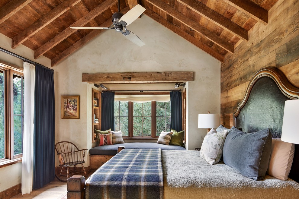 Inspiration for a country master bedroom in Other with beige walls, no fireplace and light hardwood floors.