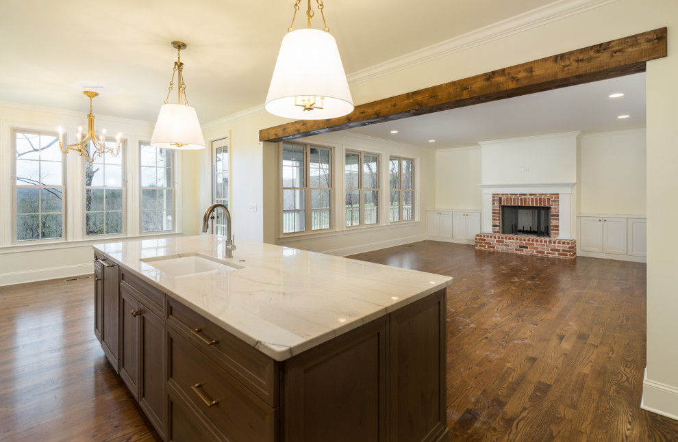 Example of a mid-sized transitional single-wall dark wood floor and brown floor eat-in kitchen design with a single-bowl sink, shaker cabinets, dark wood cabinets, granite countertops, white backsplash, stone slab backsplash, paneled appliances, an island and white countertops