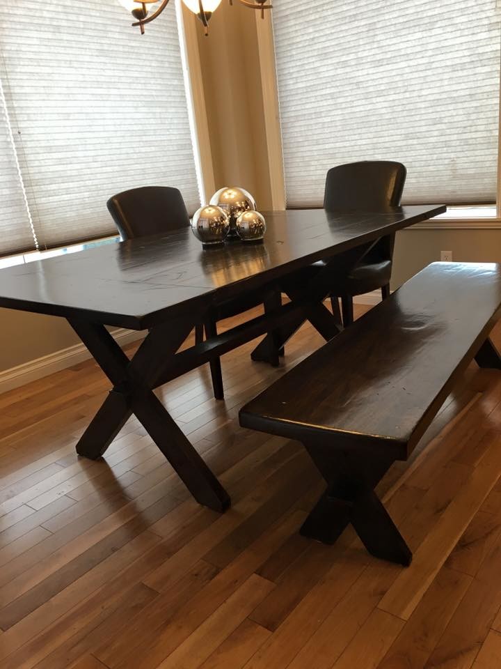 Mid-sized transitional medium tone wood floor dining room photo in Calgary with gray walls