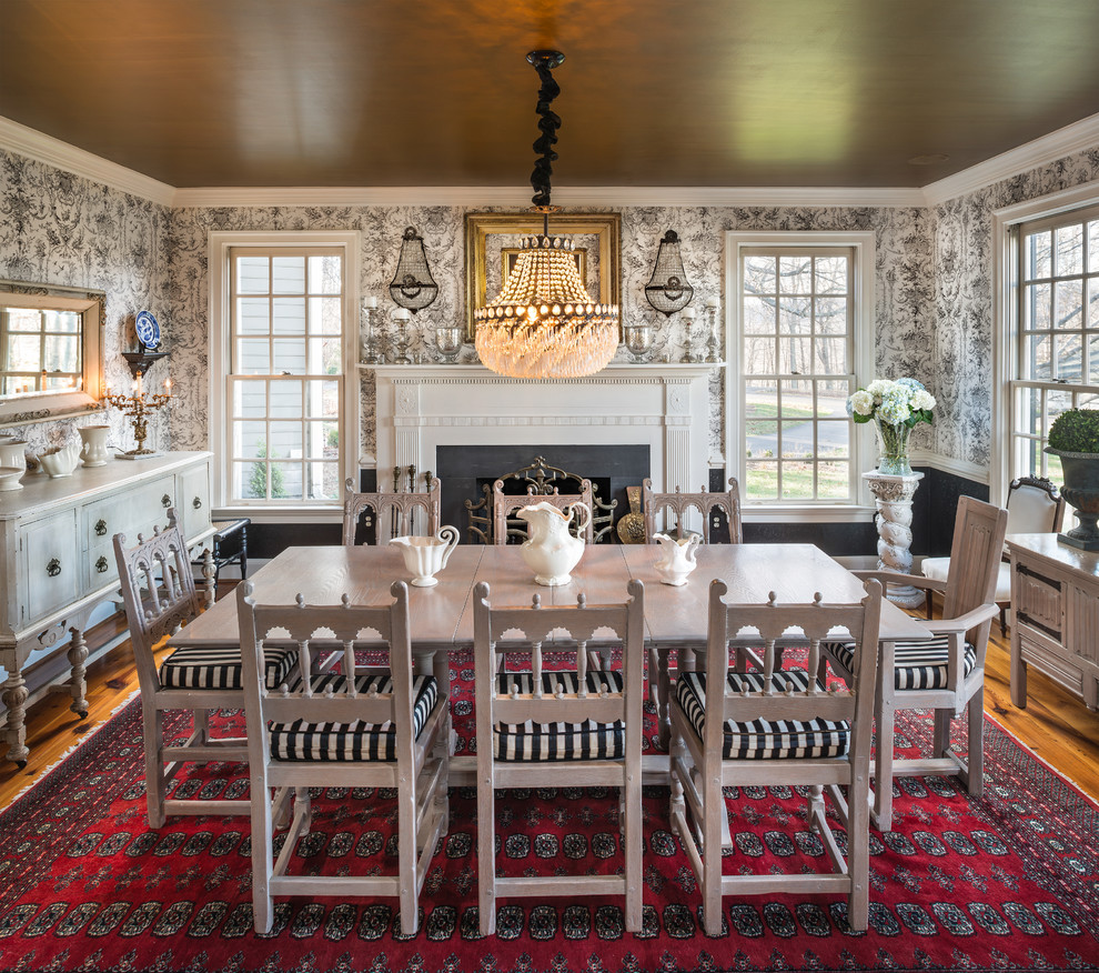 This is an example of a large traditional separate dining room in DC Metro with white walls, a stone fireplace surround, medium hardwood floors and brown floor.