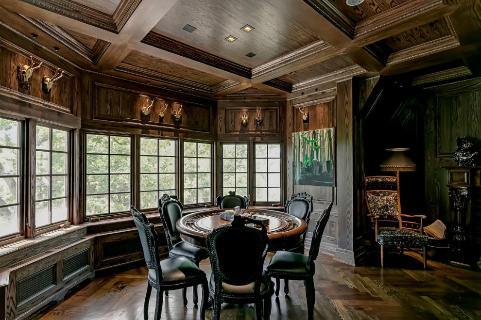 Photo of a large traditional l-shaped seated home bar in Toronto with an undermount sink, recessed-panel cabinets, dark wood cabinets, wood benchtops, dark hardwood floors, brown floor and brown benchtop.