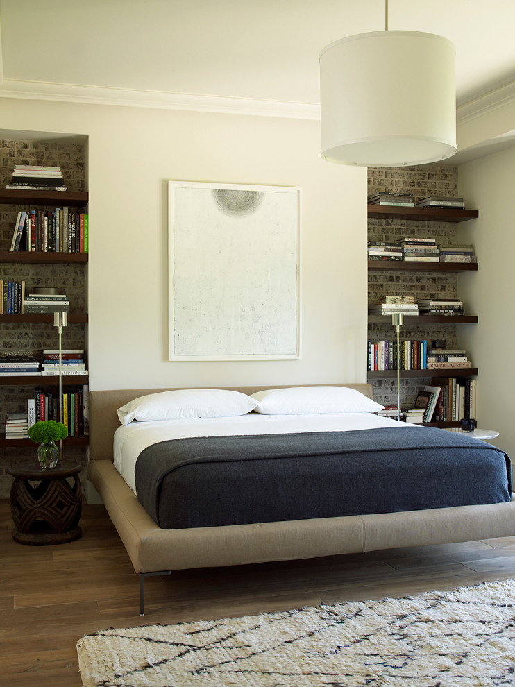 Transitional bedroom in Houston with beige walls and dark hardwood floors.