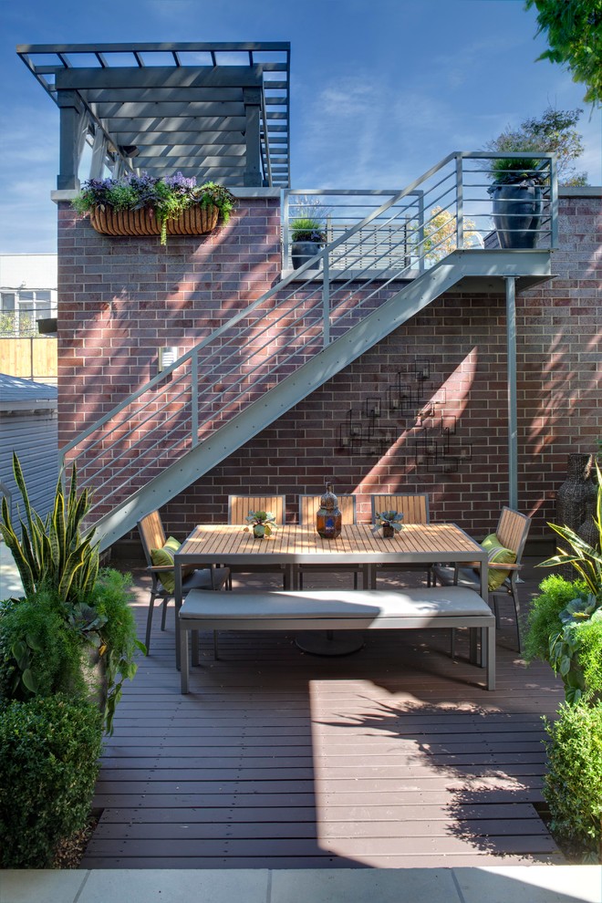 Inspiration for a contemporary deck in Chicago with a pergola.