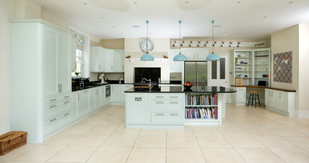 Transitional l-shaped kitchen in Other with shaker cabinets, black splashback, stainless steel appliances, with island, beige floor and blue cabinets.