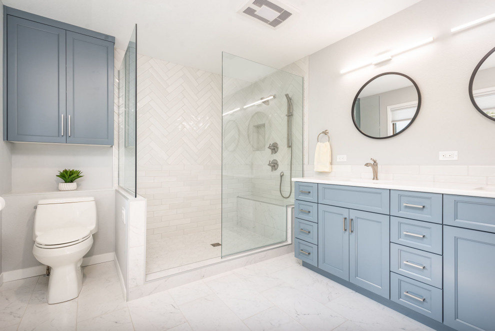 This is an example of a large transitional master bathroom in Seattle with furniture-like cabinets, engineered quartz benchtops, a double vanity and a built-in vanity.