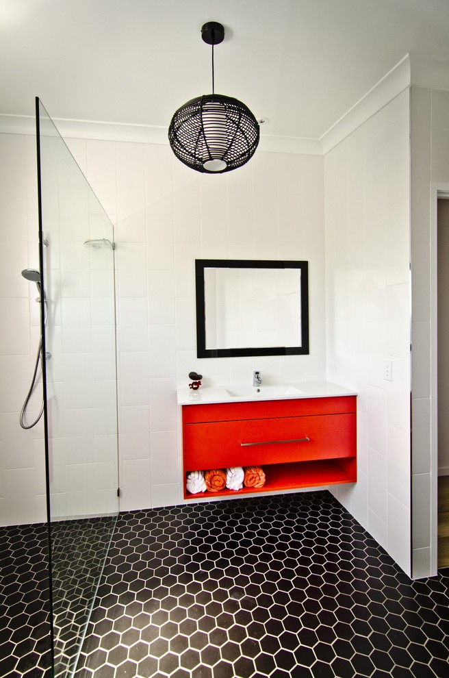 Inspiration for a small beach style master bathroom in Sunshine Coast with an integrated sink, flat-panel cabinets, red cabinets, engineered quartz benchtops, an open shower, a one-piece toilet, white tile, ceramic tile, white walls and ceramic floors.
