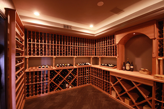 Wine cellar - rustic wine cellar idea in Denver with storage racks