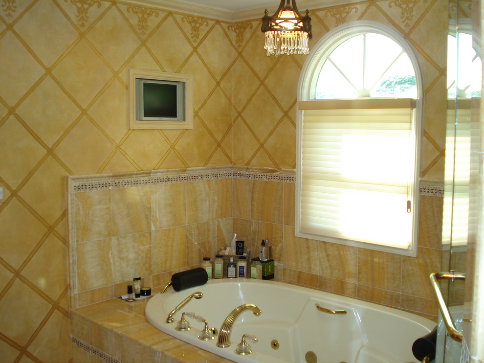 Design ideas for a mid-sized transitional master bathroom in New York with a drop-in tub, a corner shower, yellow tile, stone tile and yellow walls.