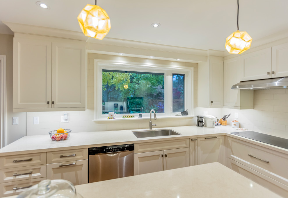 Example of a transitional kitchen design in Toronto