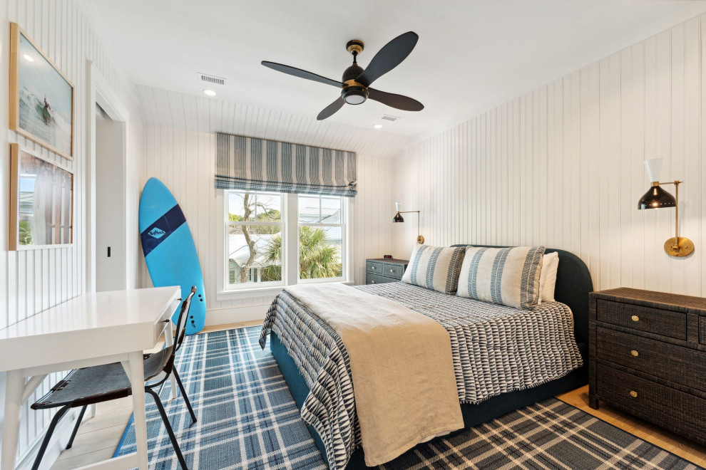 Historic Sea Cabins - Boy's bedroom featuring white oak flooring, vertical beadboard walls, custom furniture and decorative lighting.