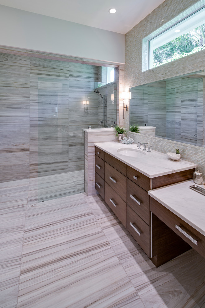 Inspiration for a large beach style master bathroom in Miami with an undermount sink, flat-panel cabinets, dark wood cabinets, engineered quartz benchtops, an open shower, a two-piece toilet, gray tile, porcelain tile, white walls and porcelain floors.
