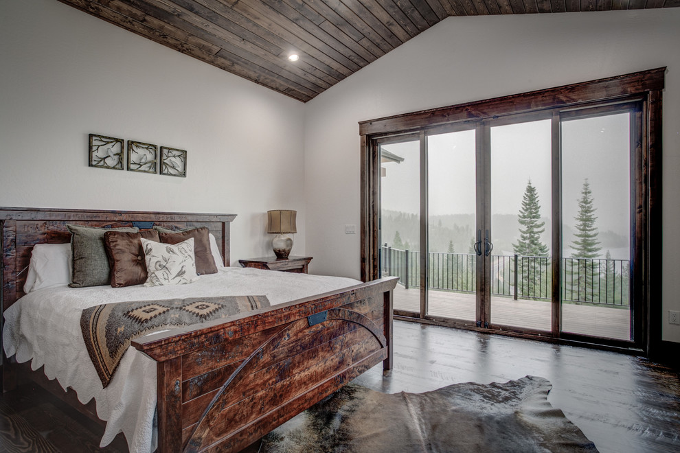 Inspiration for a mid-sized country master bedroom in Seattle with white walls and dark hardwood floors.