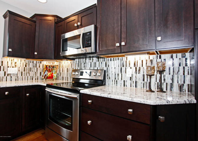Example of a transitional kitchen design in New York