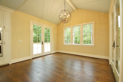 Inspiration for a mid-sized timeless dark wood floor kitchen/dining room combo remodel in Other with beige walls
