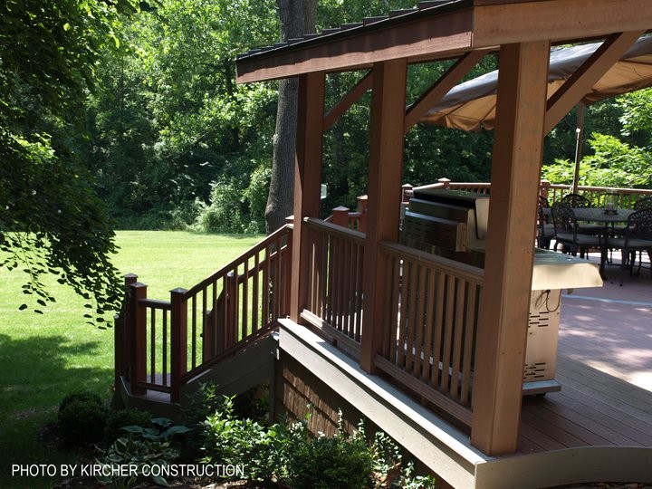 Large arts and crafts backyard deck photo in Cincinnati with a pergola