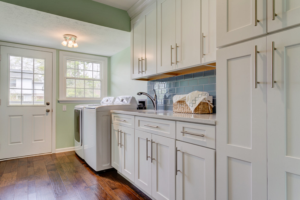 Inspiration for a large traditional utility room in Columbus with an undermount sink, shaker cabinets, white cabinets, granite benchtops, green walls, a side-by-side washer and dryer and medium hardwood floors.