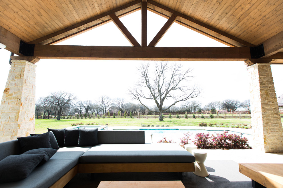 Photo of a large contemporary backyard verandah in Dallas.
