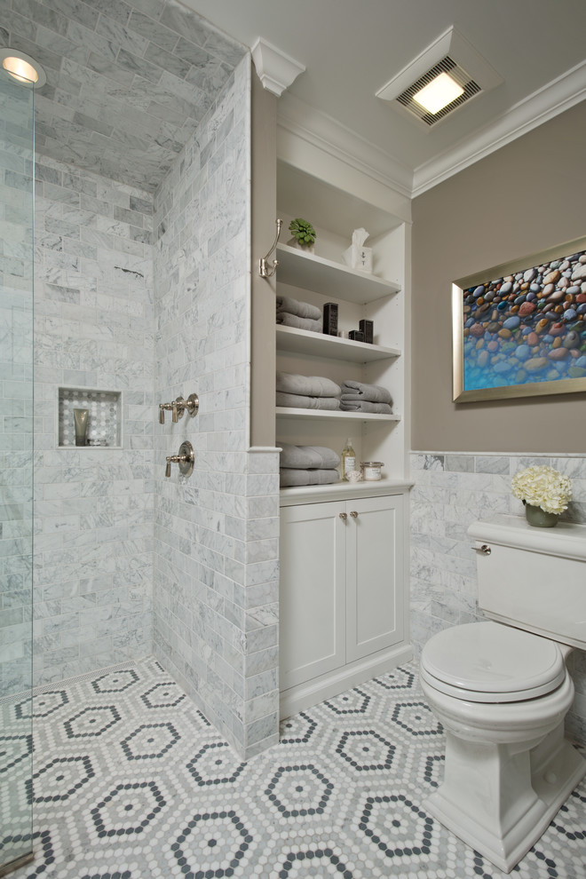 This is an example of a master bathroom in New York with open cabinets, white cabinets, an open shower, gray tile, grey walls, a pedestal sink, marble floors, a one-piece toilet, marble, wood benchtops, multi-coloured floor, an open shower and white benchtops.