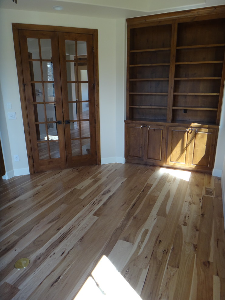 Photo of a mid-sized traditional study room in Denver with beige walls and light hardwood floors.