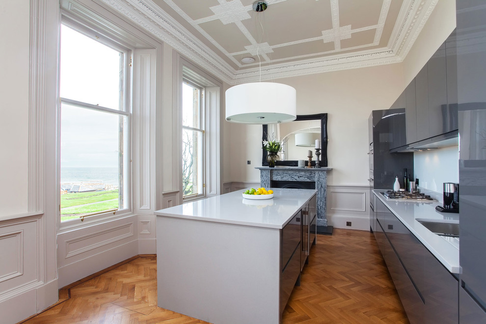 Photo of a contemporary kitchen in Edinburgh with flat-panel cabinets, grey cabinets and with island.
