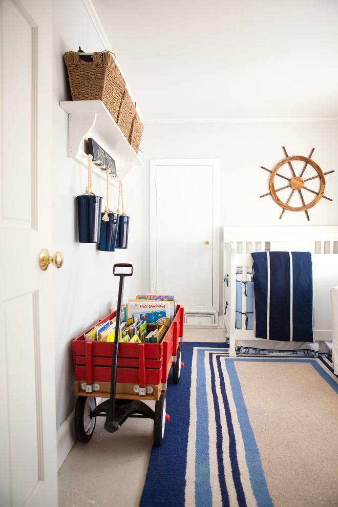 Beach style nursery in Boston with white walls for boys.