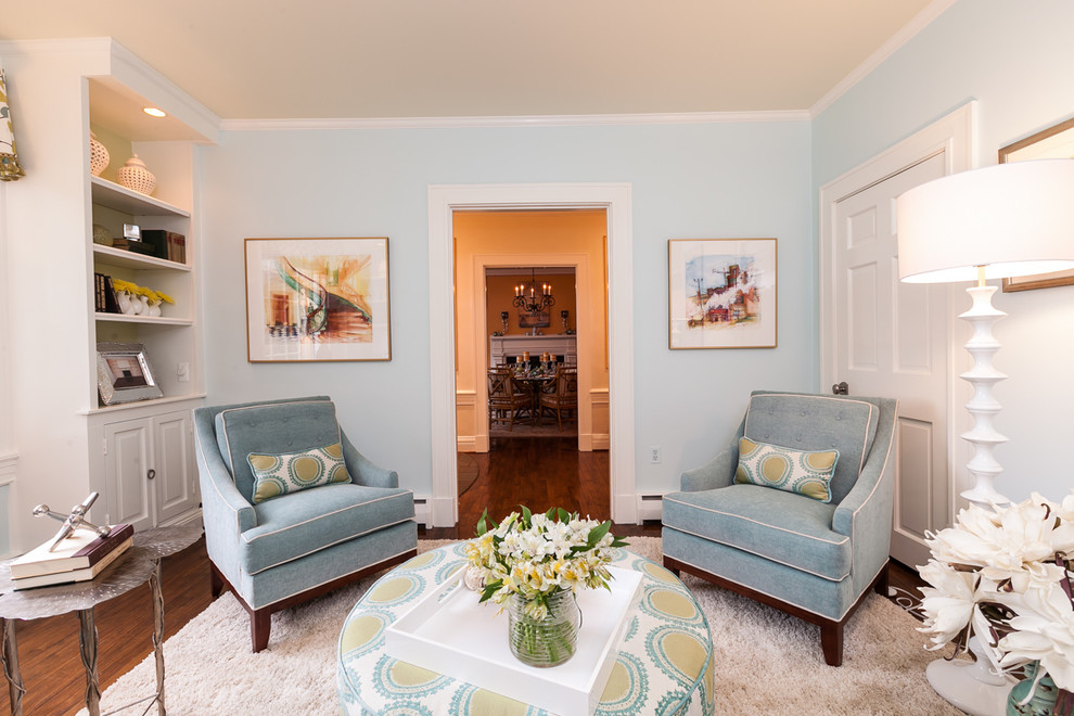 Inspiration for a mid-sized traditional formal enclosed living room in Baltimore with blue walls, medium hardwood floors, a standard fireplace, brown floor, no tv and a tile fireplace surround.