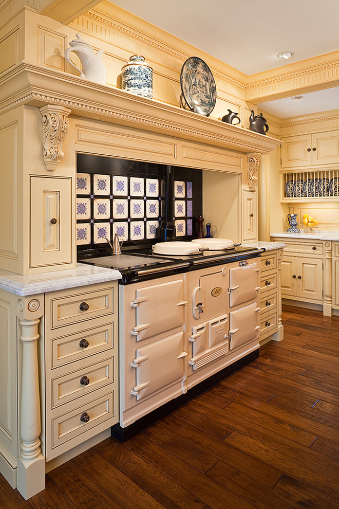 Traditional kitchen in Bridgeport with white appliances and yellow cabinets.