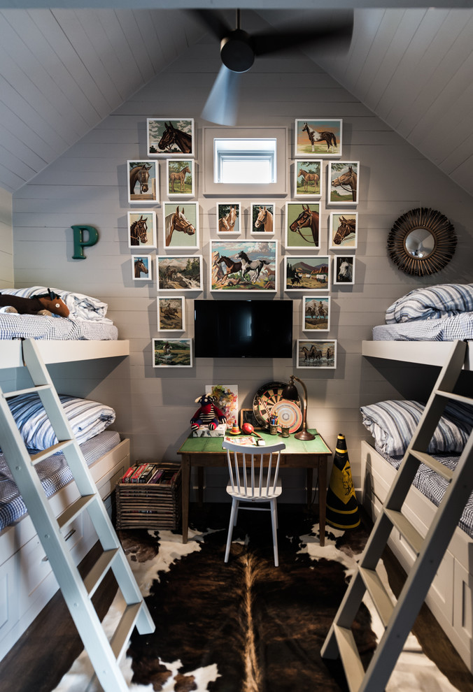 Photo of a mid-sized country gender-neutral kids' bedroom for kids 4-10 years old in Dallas with grey walls, dark hardwood floors and brown floor.