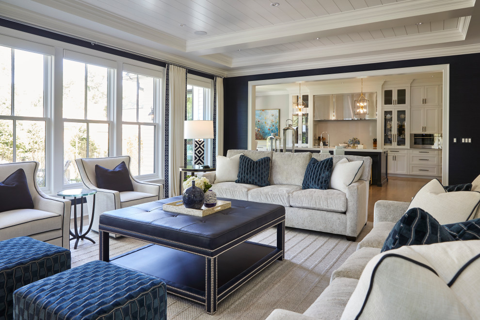 This is an example of a traditional living room in Chicago with blue walls, light hardwood floors and coffered.