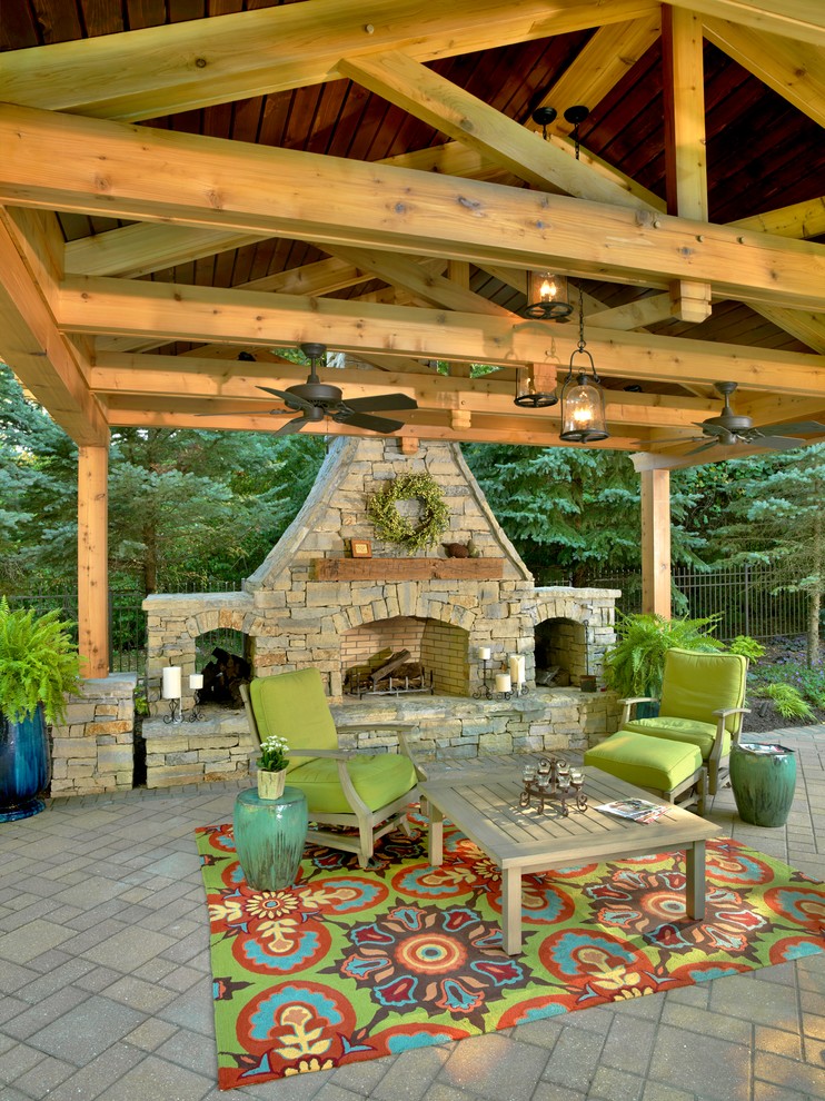 Traditional patio in Cincinnati with a fire feature and a pergola.