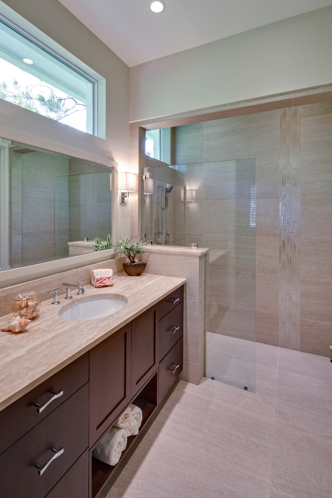 Inspiration for a large beach style master bathroom in Miami with an undermount sink, flat-panel cabinets, dark wood cabinets, engineered quartz benchtops, an open shower, a two-piece toilet, gray tile, porcelain tile, white walls and porcelain floors.