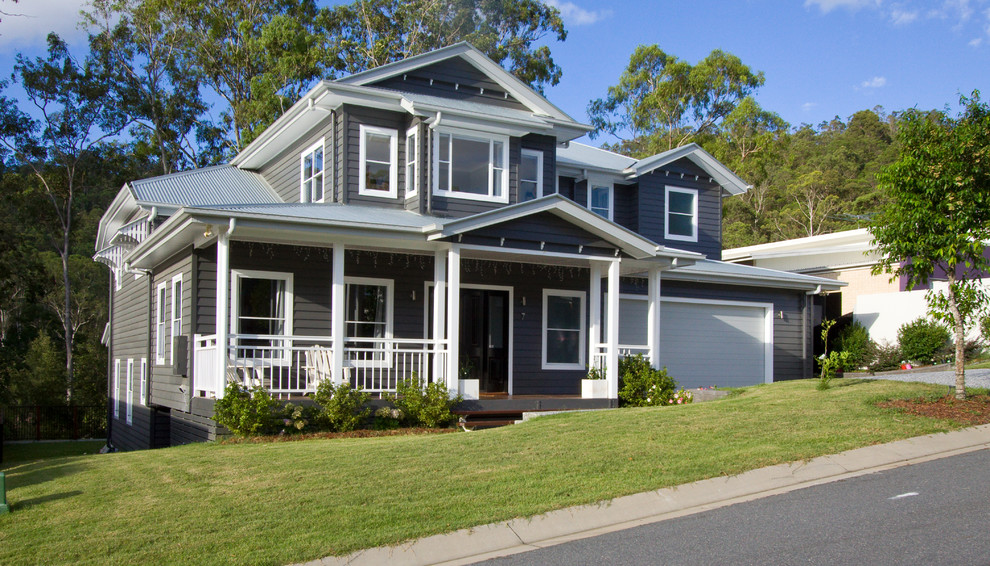 This is an example of a traditional two-storey grey house exterior in Brisbane with a hip roof and a metal roof.