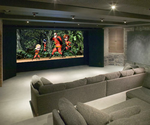 Large contemporary enclosed home theatre in Tampa with grey walls, carpet and a projector screen.