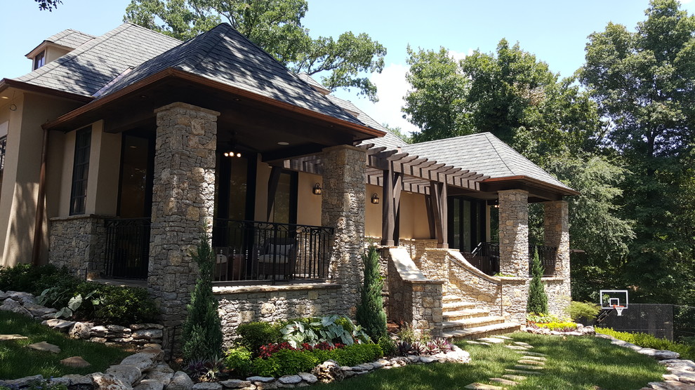Inspiration for a mid-sized rustic beige one-story mixed siding gable roof remodel with a shingle roof