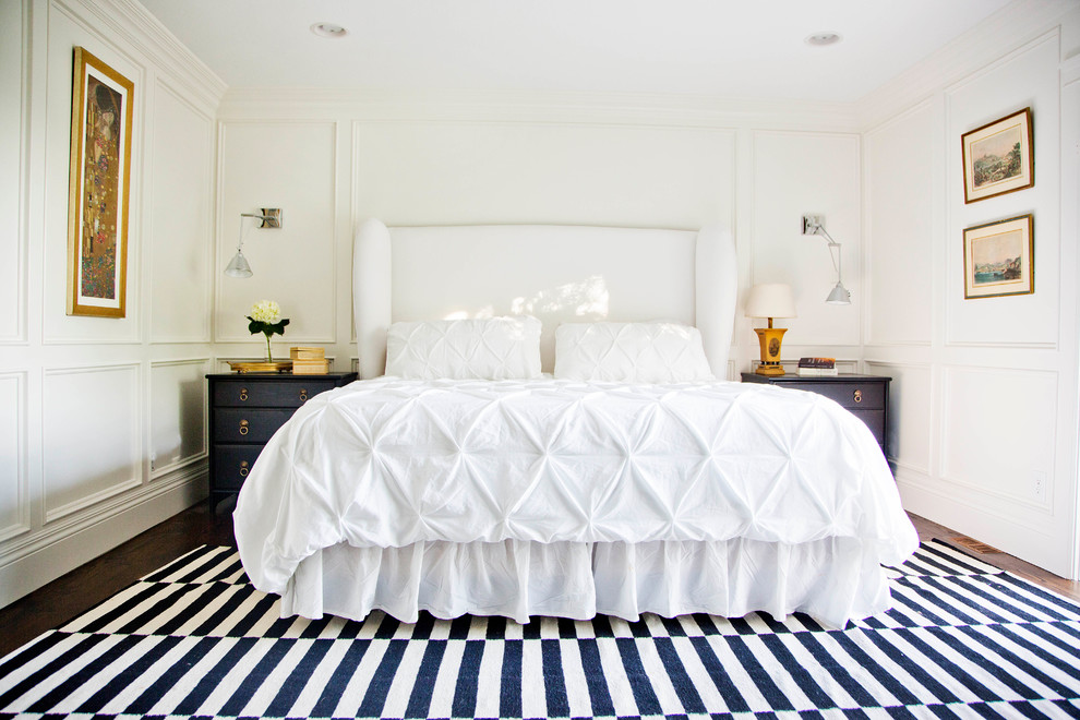 This is an example of a transitional master bedroom in Salt Lake City with white walls.