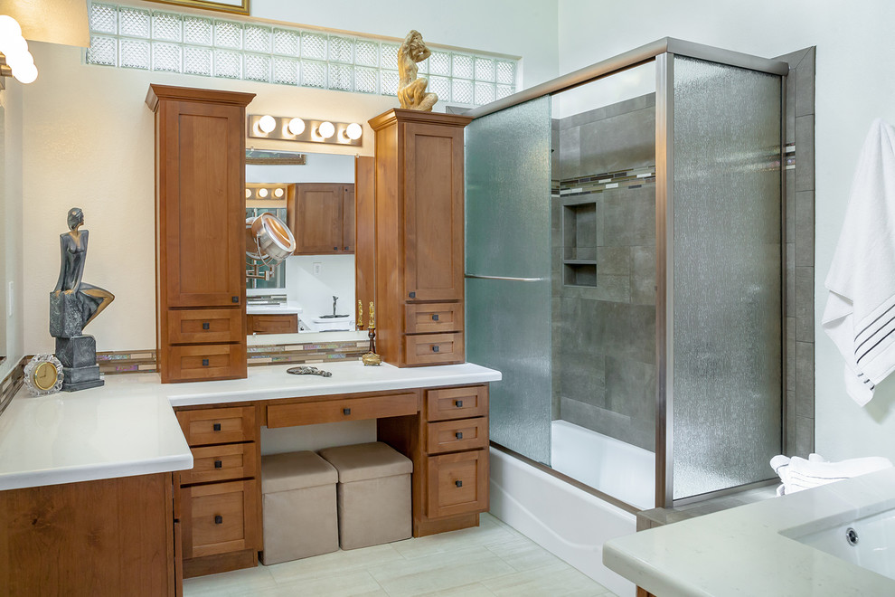 Inspiration for a large transitional master brown tile and porcelain tile porcelain tile and beige floor corner bathtub remodel in Phoenix with recessed-panel cabinets, medium tone wood cabinets, a one-piece toilet, beige walls, an undermount sink and quartz countertops
