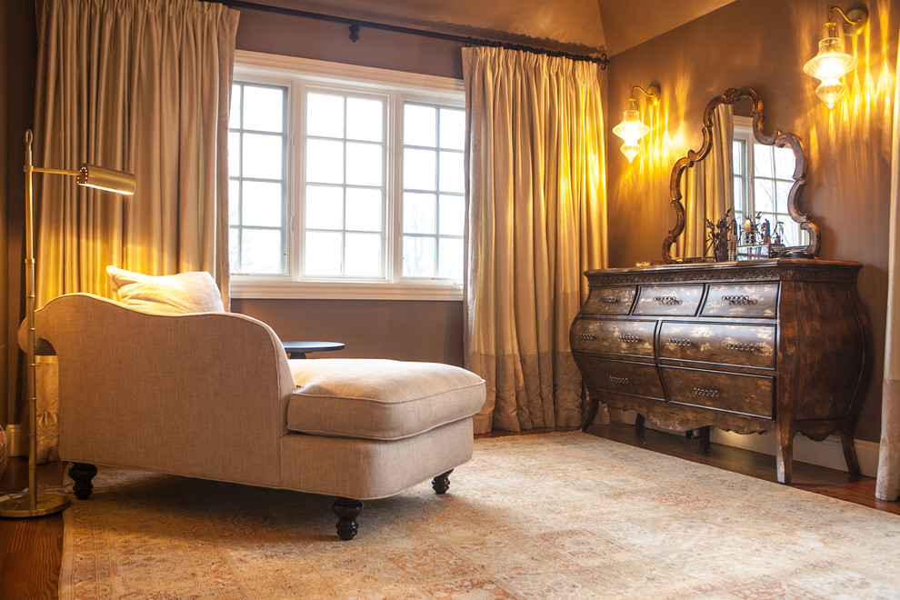 Large traditional master bedroom in New York with beige walls and carpet.