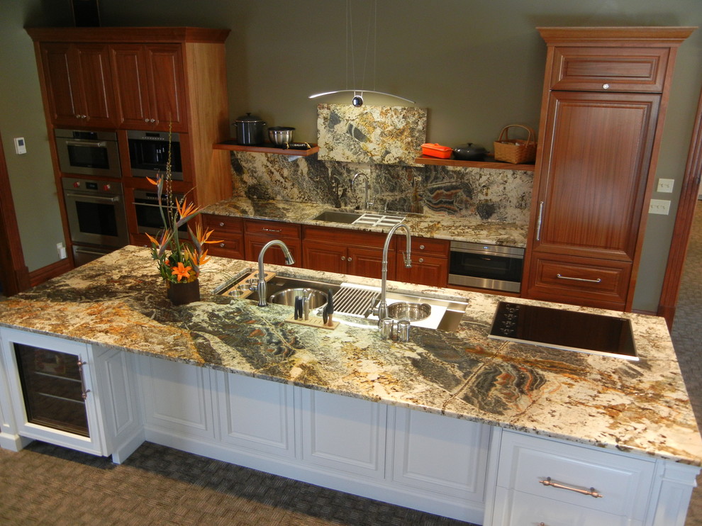 Example of a large transitional open concept kitchen design with an undermount sink, beaded inset cabinets, white cabinets, granite countertops, stone slab backsplash, stainless steel appliances and an island