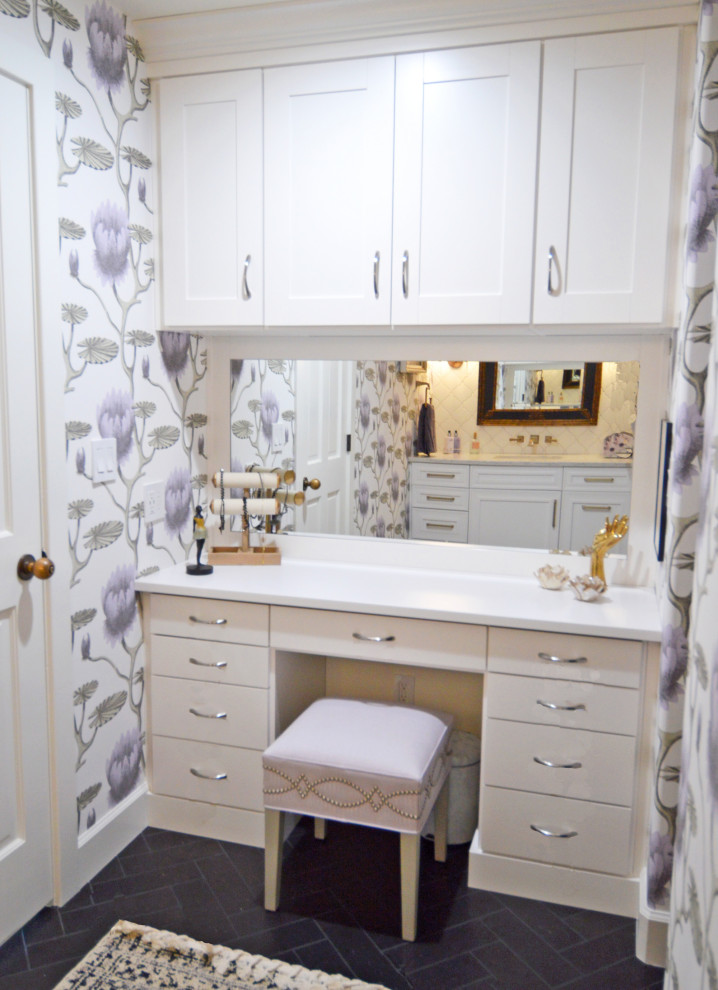 This is an example of a medium sized bathroom in Denver with white cabinets, a shower/bath combination, white tiles, ceramic tiles, purple walls, a submerged sink, engineered stone worktops, black floors, a sliding door, white worktops, a wall niche, a single sink, a built in vanity unit and wallpapered walls.