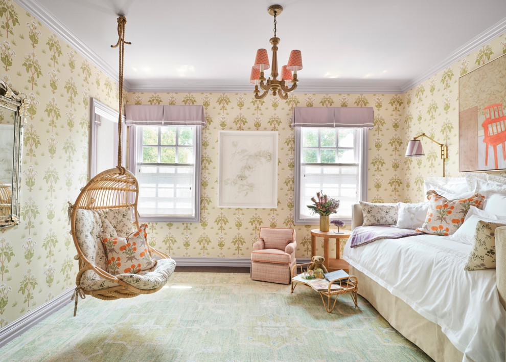 Photo of a large traditional kids' bedroom for kids 4-10 years old and girls with green walls, medium hardwood floors and wallpaper.