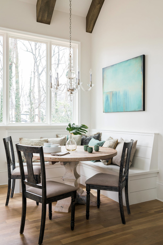 Inspiration for a small country open plan dining in Atlanta with white walls, medium hardwood floors, no fireplace and brown floor.