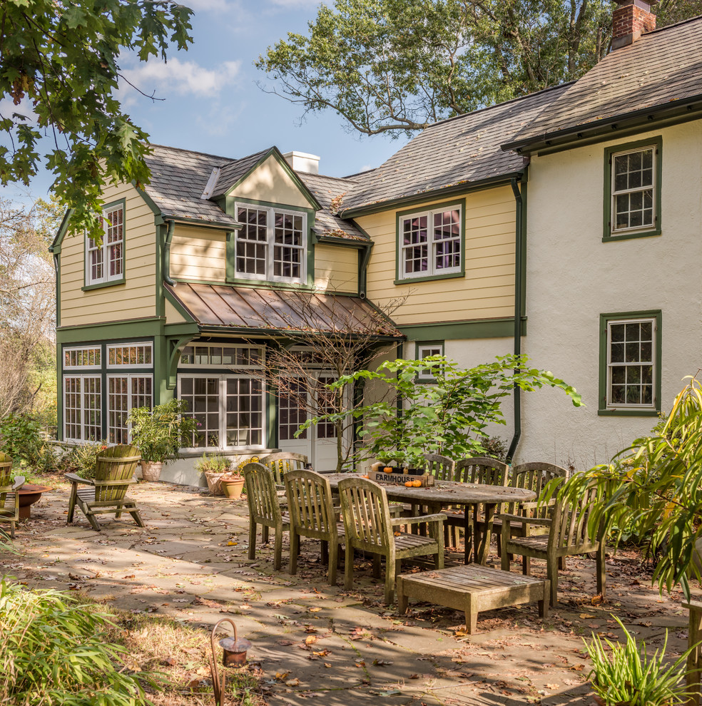 Example of a country patio design in Philadelphia with no cover