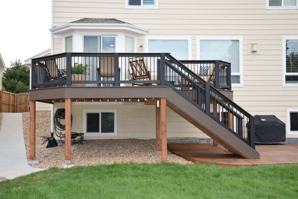 Mid-sized transitional backyard patio in Denver with decking and no cover.