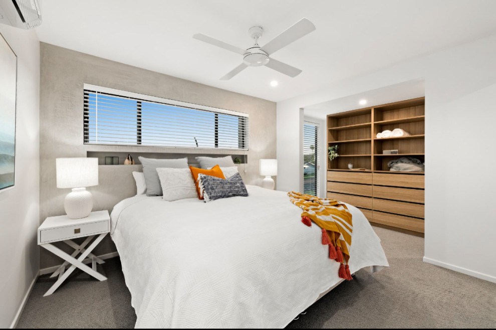 Inspiration for a large modern master bedroom in Sunshine Coast with grey walls, carpet and grey floor.