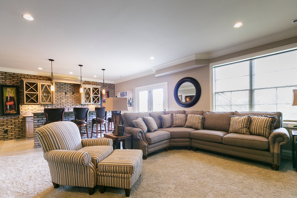 Inspiration for a large transitional walk-out basement in Louisville with beige walls, carpet and no fireplace.