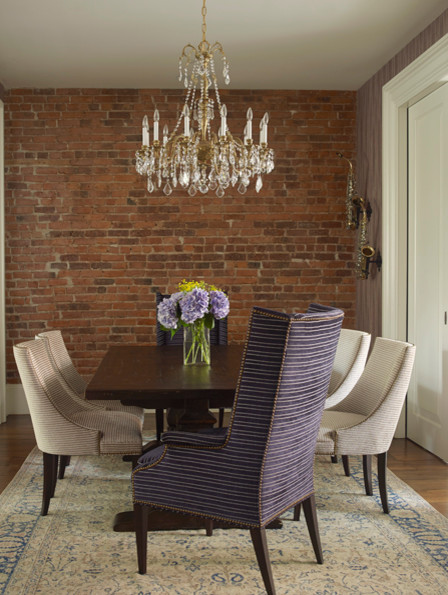 Mid-sized transitional separate dining room in New York with red walls and dark hardwood floors.