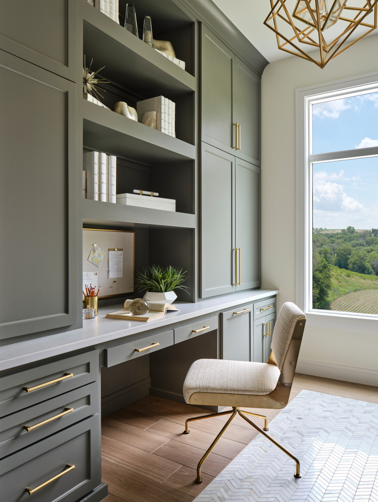 Mid-sized transitional built-in desk porcelain tile and beige floor study room photo in Omaha with white walls