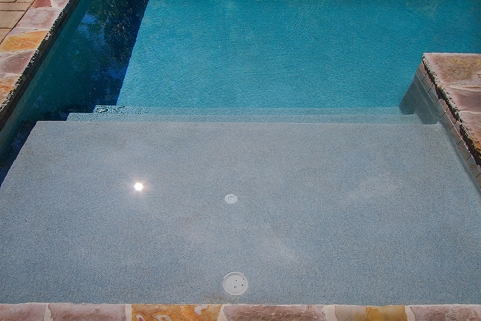 Inspiration for a huge rustic backyard concrete paver and rectangular lap pool remodel in Raleigh