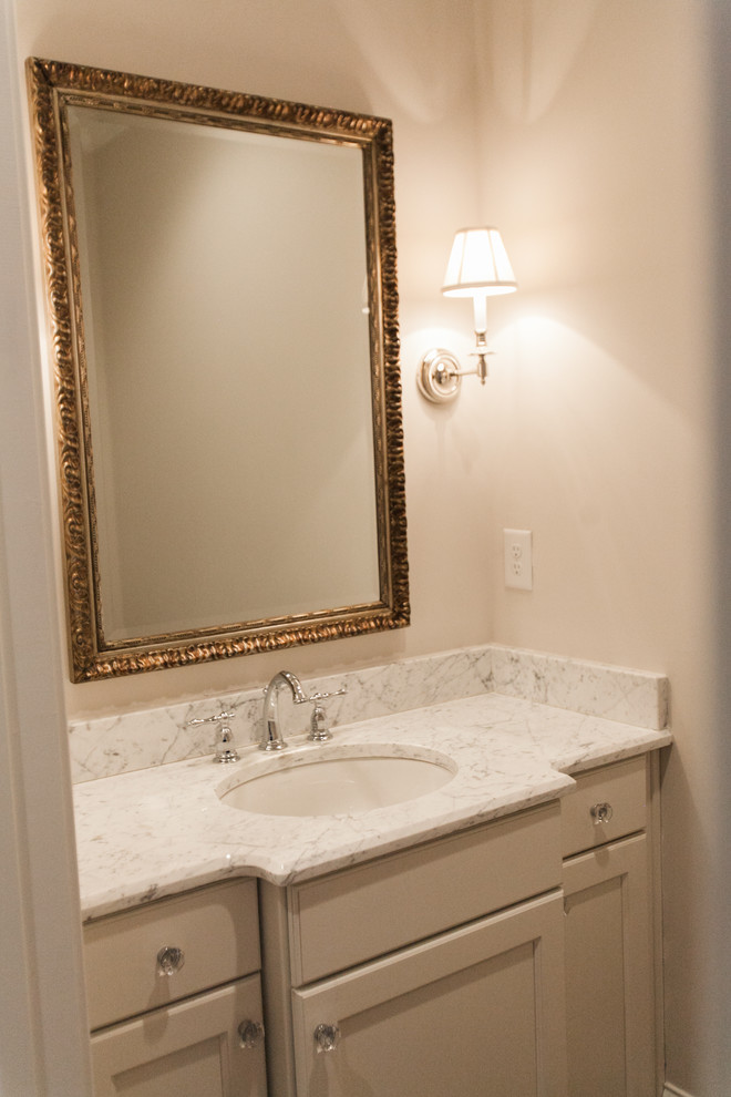 Inspiration for a timeless powder room remodel in Raleigh